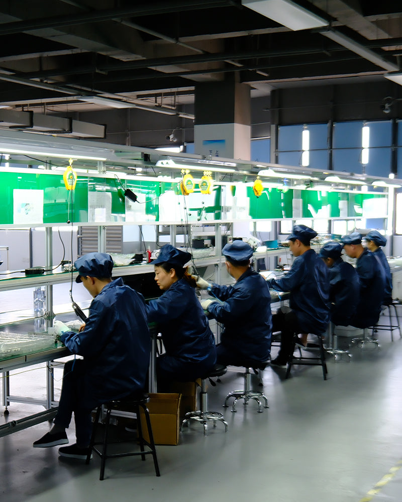 Behind-the-scenes view of BSCOBBER’s factory workers assembling electric air pumps with precision.
