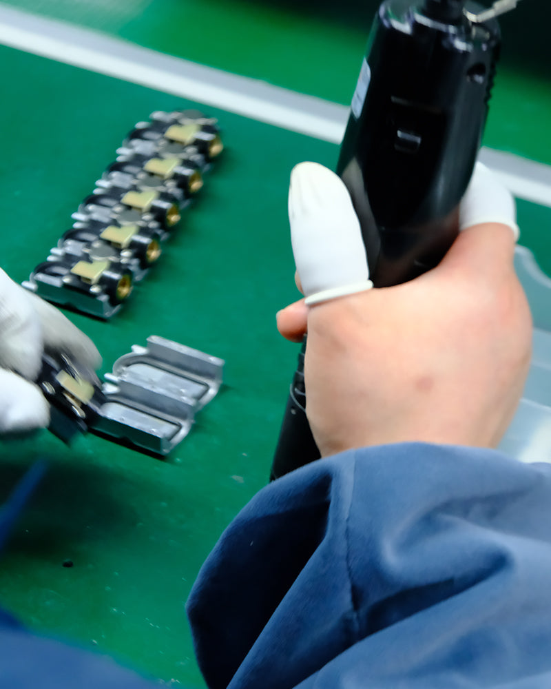 High-efficiency production line manufacturing electric bike inflators under strict quality control.